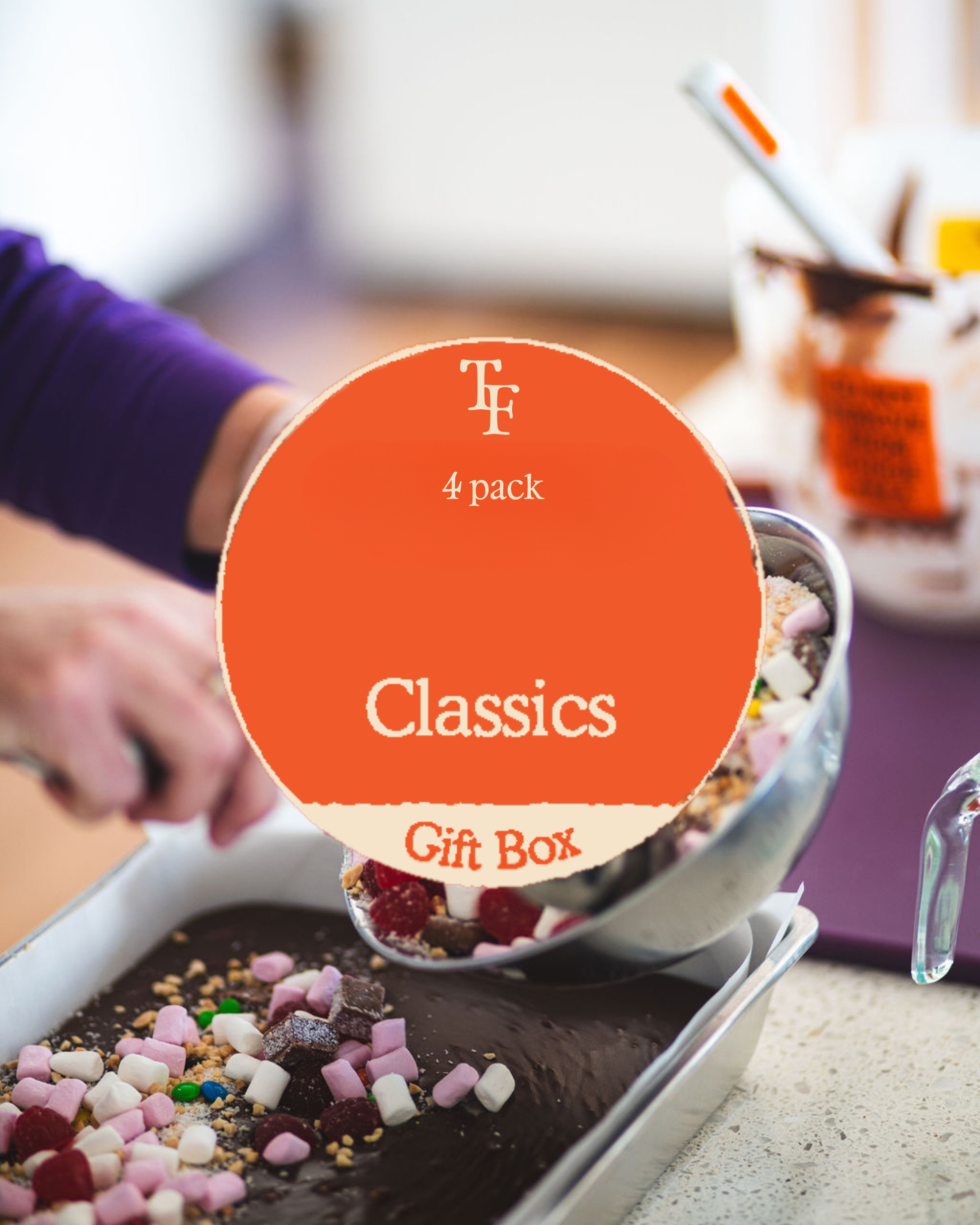 “Classic fudge being topped with marshmallows and sweets with a Tamar Fudge Classics 4-pack gift box label overlaying the image.